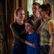 The Locke family embraces, looking alarmed.